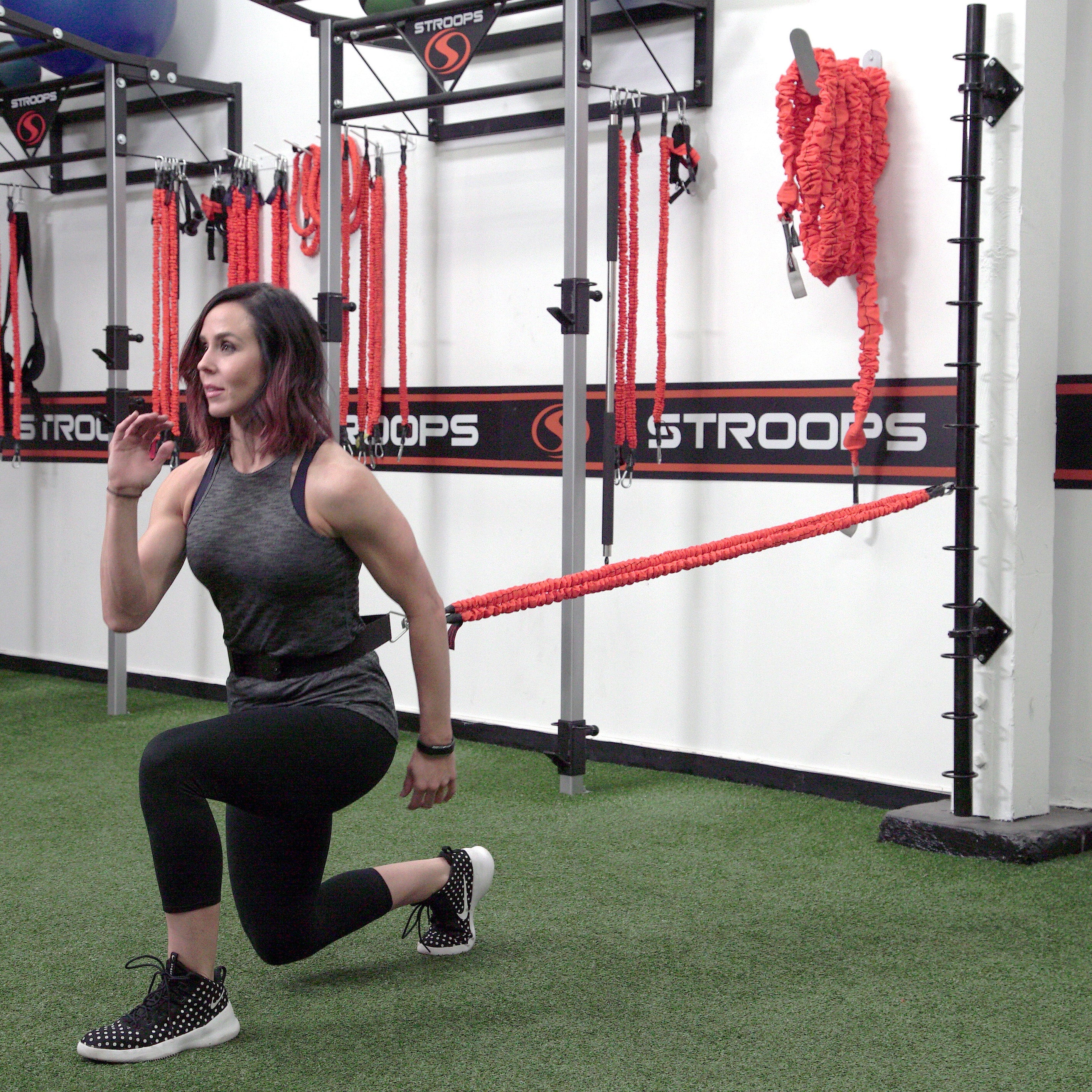 woman lunging off Stroops Spine